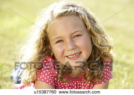 Portrait of young girl in countryside View Large Photo Image Stock Image - Portrait of young girl in countryside. Fotosearch