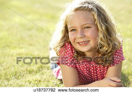 Portrait of young girl in countryside View Large Photo Image Stock Image - Portrait of young girl in countryside. Fotosearch