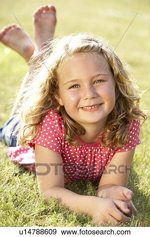 Stock Photo - Portrait of young girl in countryside. Fotosearch