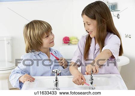 Siblings Brushing Teeth Together at Sink View Large Photo Image Stock Image - Siblings Brushing Teeth Together at Sink. Fotosearch