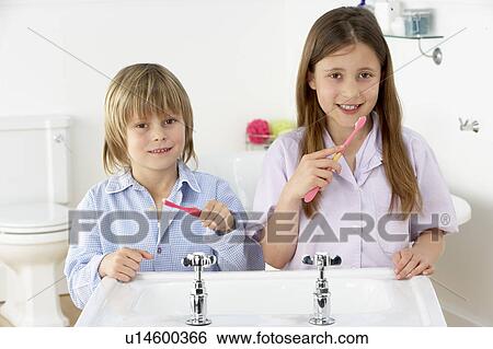 Siblings Brushing Teeth Together at Sink View Large Photo Image Stock Photograph - Siblings Brushing Teeth Together at Sink. Fotosearch