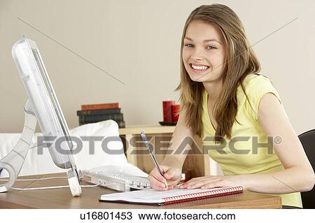 Smiling Teenage Girl Studying at Home View Large Photo Image Stock Image - Smiling Teenage Girl Studying at Home. Fotosearch