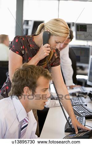 Stock Image - Stock Trader On The Phone. Fotosearch