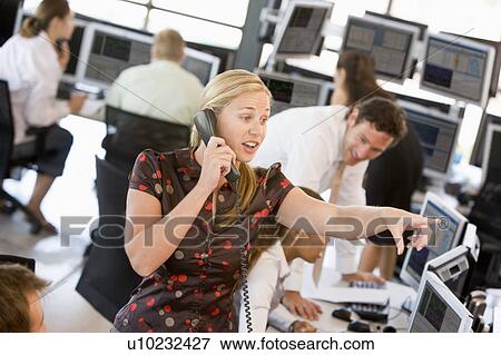 Stock Photo - Stock Trader On The Phone. Fotosearch