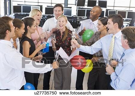 Stock Image - Stock Traders Celebrating In The Office. Fotosearch