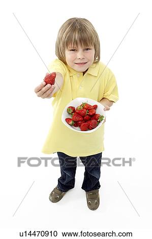 Studio Portrait of Smiling Boy Holding Bowl of Strawberries View Large Photo Image Stock Image - Studio Portrait of Smiling Boy Holding Bowl of Strawberries. Fotosearch