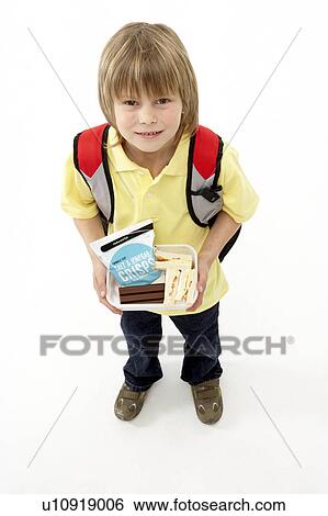 Studio Portrait of Smiling Boy Holding Lunchbox View Large Photo Image Stock Photograph - Studio Portrait of Smiling Boy Holding Lunchbox. Fotosearch