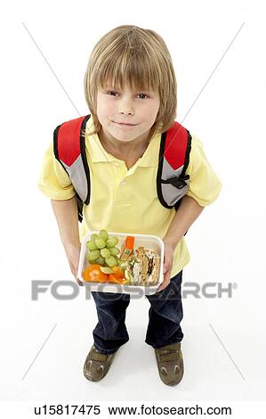 Studio Portrait of Smiling Boy Holding Lunchbox View Large Photo Image Stock Photography - Studio Portrait of Smiling Boy Holding Lunchbox. Fotosearch