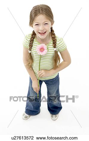 Studio Portrait of Smiling Girl Holding Flower View Large Photo Image Stock Image - Studio Portrait of Smiling Girl Holding Flower. Fotosearch