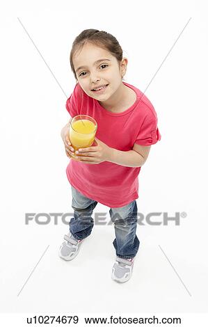 Studio Portrait of Smiling Girl Holding Glass of Orange Juice View Large Photo Image Stock Photo - Studio Portrait of Smiling Girl Holding Glass of Orange Juice. Fotosearch