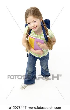 Stock Photo - Studio Portrait of Smiling Girl Holding School Book. Fotosearch