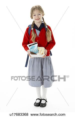 Stock Photo - Studio Portrait of Smiling Girl Holding Lunchbox. Fotosearch