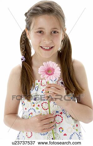 Studio Portrait of Smiling Girl Holding Flower View Large Photo Image Stock Photo - Studio Portrait of Smiling Girl Holding Flower. Fotosearch
