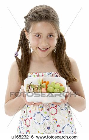 Studio Portrait of Smiling Girl Holding Lunchbox View Large Photo Image Stock Photograph - Studio Portrait of Smiling Girl Holding Lunchbox. Fotosearch