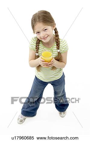 Studio Portrait of Smiling Girl Holding Orange Juice View Large Photo Image Stock Photography - Studio Portrait of Smiling Girl Holding Orange Juice. Fotosearch