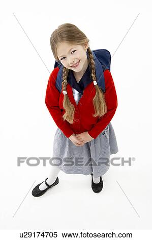 Stock Photography - Studio Portrait of Smiling Girl Wearing School Bag. Fotosearch
