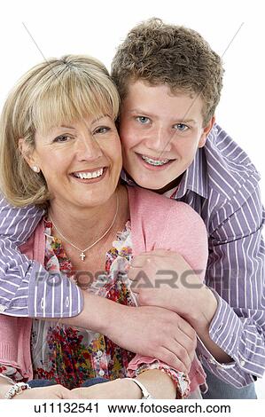Studio Portrait of Smiling Teenage Boy with Mum View Large Photo Image Stock Image - Studio Portrait of Smiling Teenage Boy with Mum. Fotosearch
