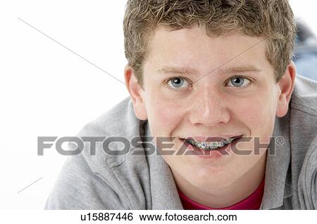 Studio Portrait of Smiling Teenage Boy View Large Photo Image Stock Photograph - Studio Portrait of Smiling Teenage Boy. Fotosearch