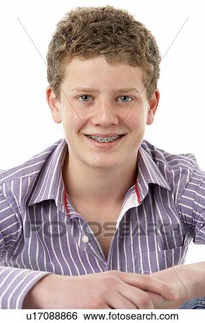 Stock Photograph - Studio Portrait of Smiling Teenage Boy. Fotosearch