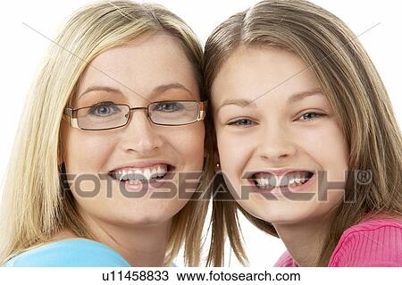 Studio Portrait of Smiling Teenage Girl with older Sister View Large Photo Image Stock Image - Studio Portrait of Smiling Teenage Girl with older Sister. Fotosearch