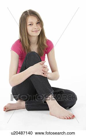 Stock Image - Studio Portrait of Smiling Teenage Girl. Fotosearch