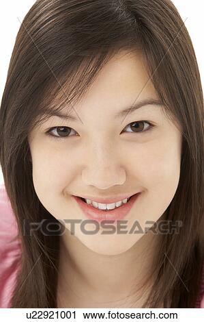 Stock Image - Studio Portrait of Smiling Teenage Girl. Fotosearch