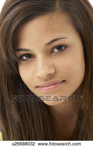 Stock Image - Studio Portrait of Smiling Teenage Girl. Fotosearch