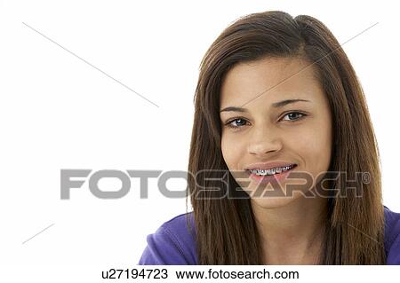 Stock Image - Studio Portrait of Smiling Teenage Girl. Fotosearch