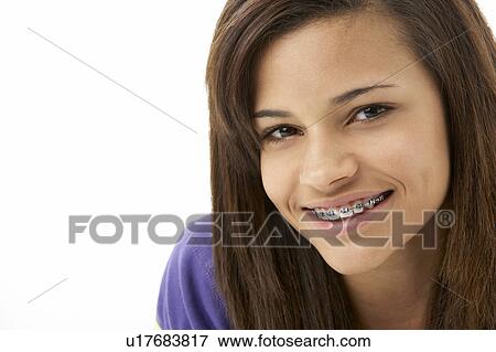 Stock Photo - Studio Portrait of Smiling Teenage Girl. Fotosearch