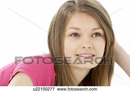 Stock Photo - Studio Portrait of Smiling Teenage Girl. Fotosearch