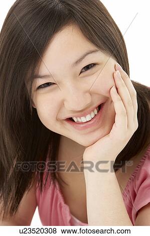 Studio Portrait of Smiling Teenage Girl View Large Photo Image Stock Photo - Studio Portrait of Smiling Teenage Girl. Fotosearch