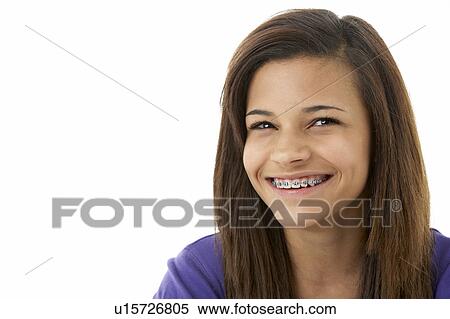 Stock Photography - Studio Portrait of Smiling Teenage Girl. Fotosearch