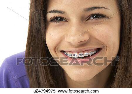 Stock Photography - Studio Portrait of Smiling Teenage Girl. Fotosearch