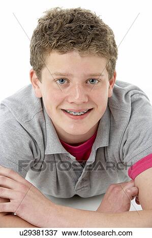 Stock Photo - Teenage Boy Laying on Stomach. Fotosearch
