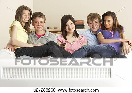 Teenage Friends Watching Television at Home View Large Photo Image Stock Photograph - Teenage Friends Watching Television at Home. Fotosearch