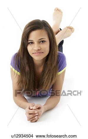 Picture - Teenage Girl Laying on Stomach. Fotosearch