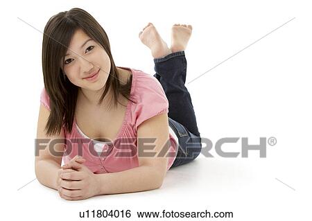 Stock Photograph - Teenage Girl Laying on Stomach. Fotosearch