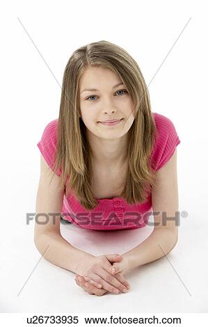 Stock Photography - Teenage Girl Laying on Stomach. Fotosearch