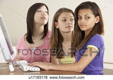 Teenage Girlfriends on Computer at Home View Large Photo Image Stock Photo - Teenage Girlfriends on Computer at Home. Fotosearch