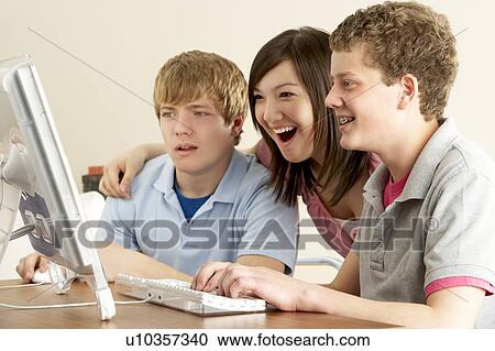 Stock Image - Teenagers on Computer at Home. Fotosearch