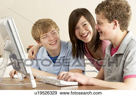 Stock Photo - Teenagers on Computer at Home. Fotosearch