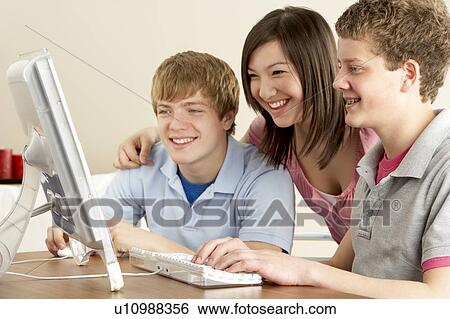 Teenagers on Computer at Home View Large Photo Image Stock Photograph - Teenagers on Computer at Home. Fotosearch