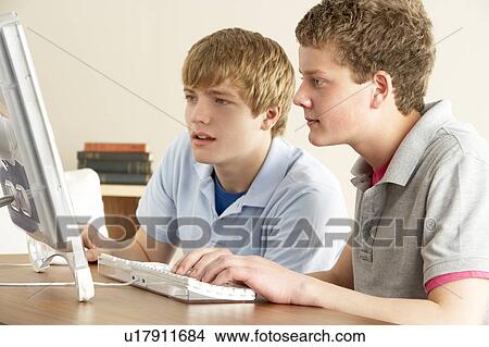Two Teenage Boys on Computer at Home View Large Photo Image Picture - Two Teenage Boys on Computer at Home. Fotosearch