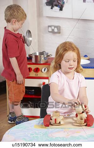 Two Young Children Playing Together at Montessori/Pre-School View Large Photo Image Picture - Two Young Children Playing Together at Montessori/Pre-School. Fotosearch