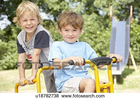Stock Photo - Two Young Girls Playing in Wooden House. Fotosearch