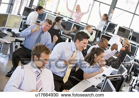 Stock Image - View Of Busy Stock Traders Office. Fotosearch