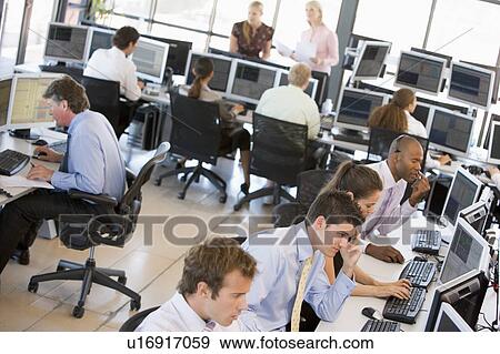 Stock Photo - View Of Busy Stock Traders Office. Fotosearch