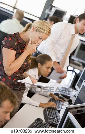 Woman Looking At Stock Reports View Large Photo Image Stock Photography - Woman Looking At Stock Reports. Fotosearch