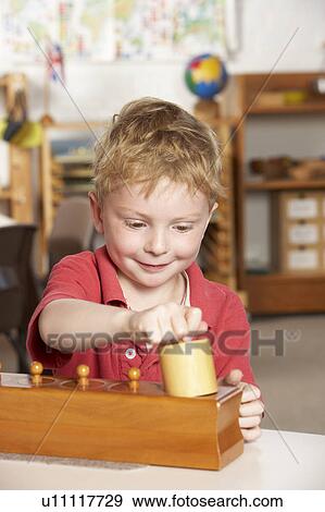 Young Boy Playing at Montessori/Pre-School View Large Photo Image Stock Photo - Young Boy Playing at Montessori/Pre-School. Fotosearch