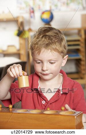 Young Boy Playing at Montessori/Pre-School View Large Photo Image Stock Photo - Young Boy Playing at Montessori/Pre-School. Fotosearch